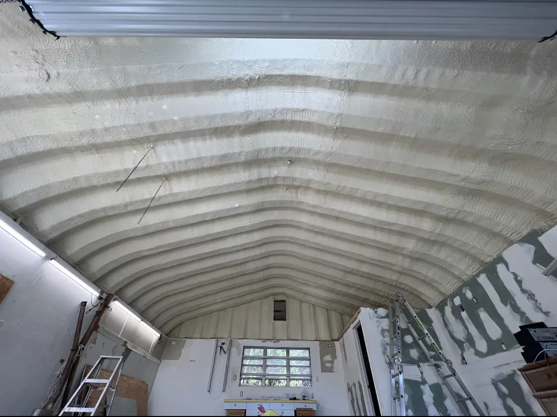Spray polyurethane foam applied to the underside of a metal roof deck in Westborough